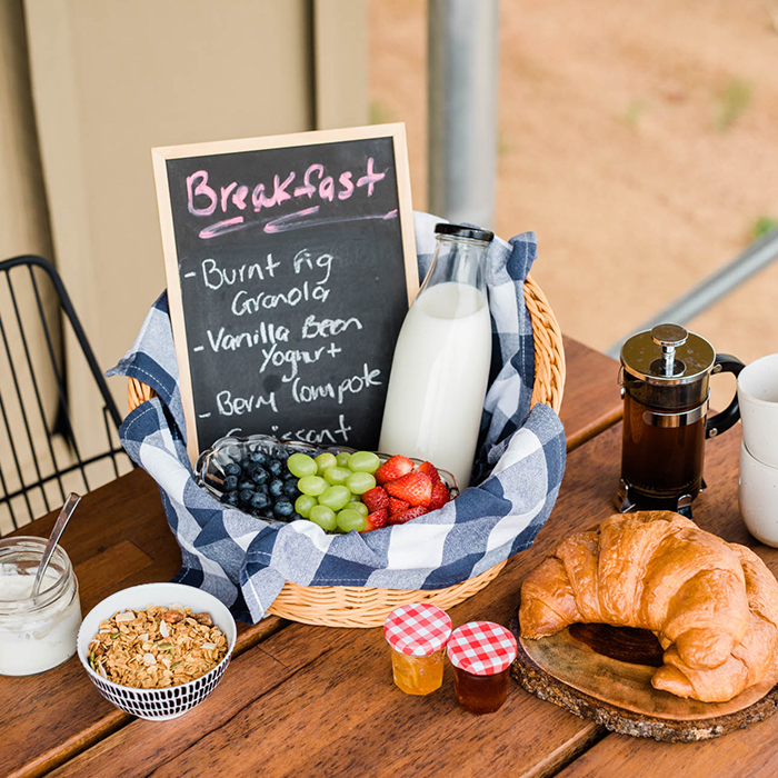 breakfast basket including pastry, fruit, dairy and more