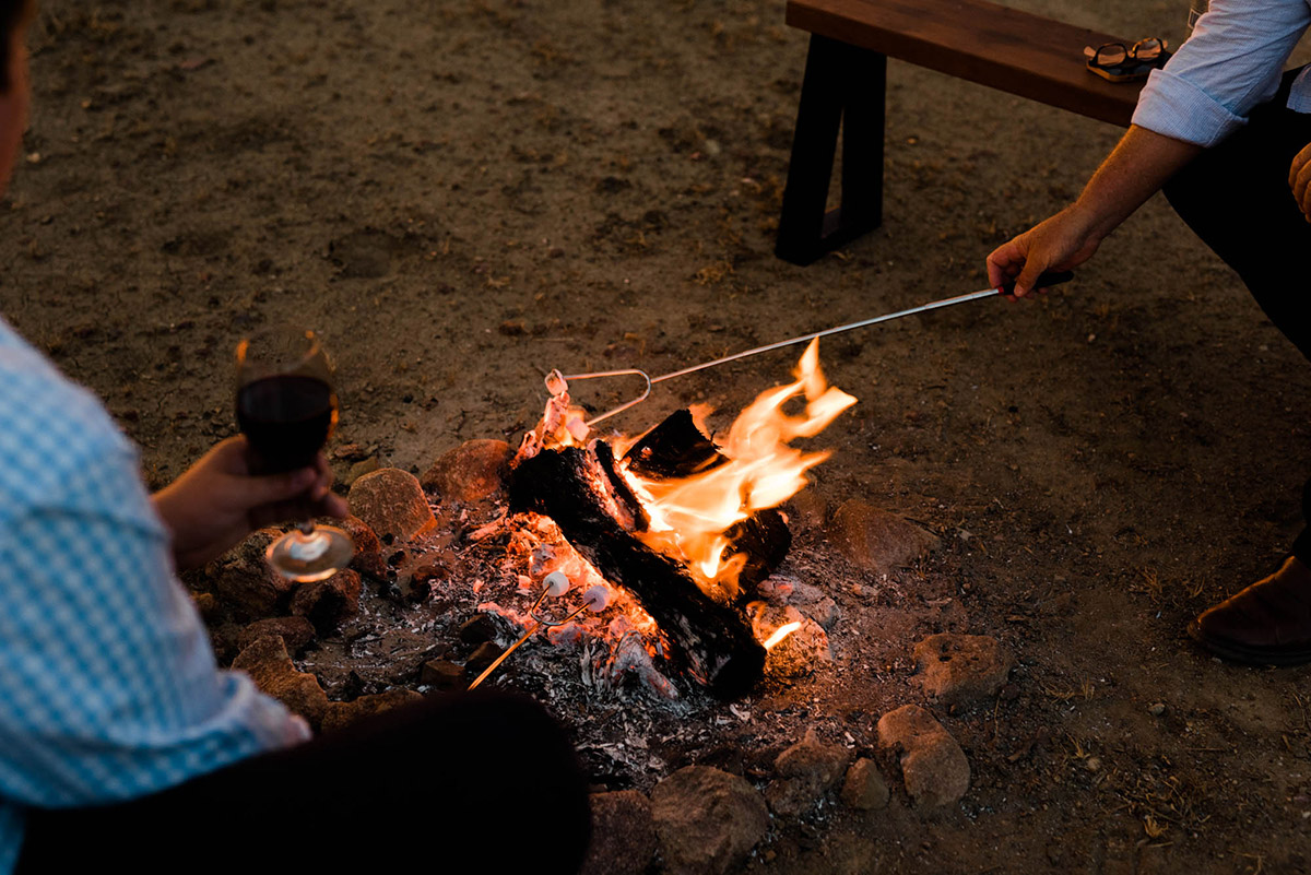 camp fire toasting mashmallows